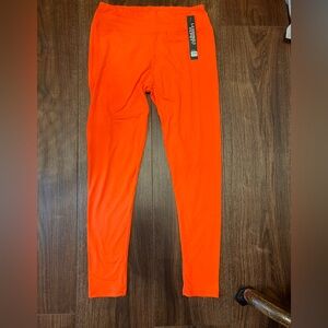 Orange leggings. NWOT